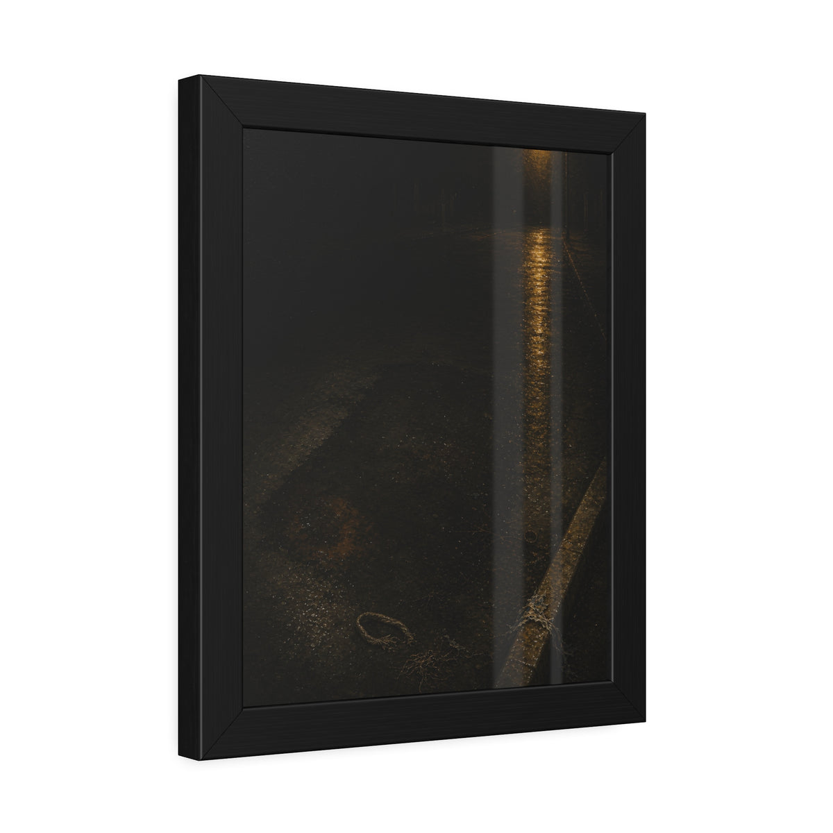 A rectangular stain on wet asphalt where something lay, under a streetlamp. The Stain After Removal by Garabaggio, framed fine art print hanging in a room.
