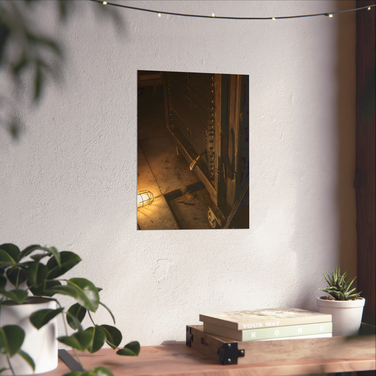 A server rack on a concrete floor beside a caged work light. The Silence at Cutover by Garabaggio, fine art print hanging in a room.