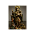 A standing veiled figure holding a child, refuse piled around the base. The Virgin of the Landfill by Garabaggio, fine art print, 12″ x 16″.