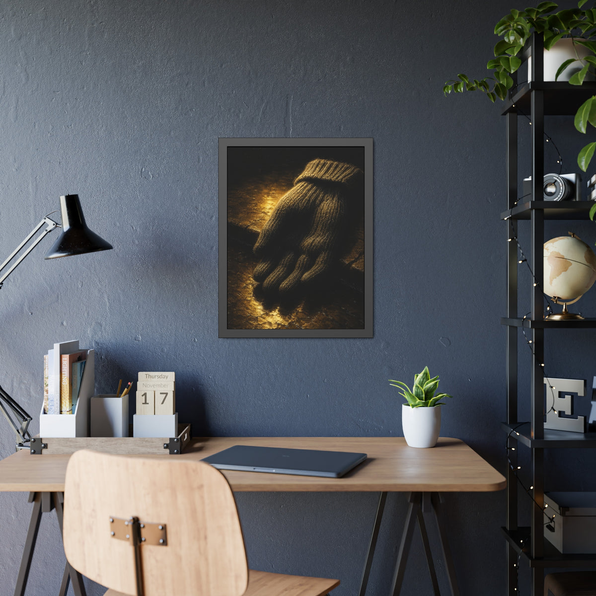 A knitted wool glove palm down on wet stone in gold light. The Presentation of the Woolen Glove by Garabaggio, framed fine art print hanging in a room.