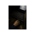 A hand on a mouse beside a grimy keyboard and a pale glowing screen. Login Before Dawn by Garabaggio, fine art print, 12″ x 16″.