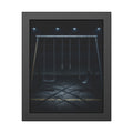 An empty swing set at night, chains still, floodlights far behind it. The Tenth Hour: The Chains Settle by Garabaggio, framed fine art print, 11″ x 14″.