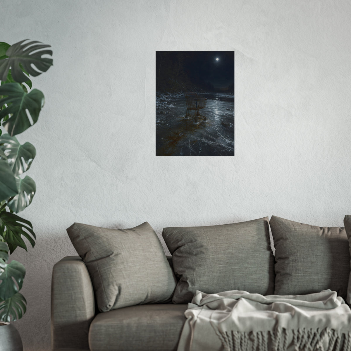 A rusted shopping cart frozen into moonlit river ice. The Wintering in the Ice by Garabaggio, fine art print hanging in a room.