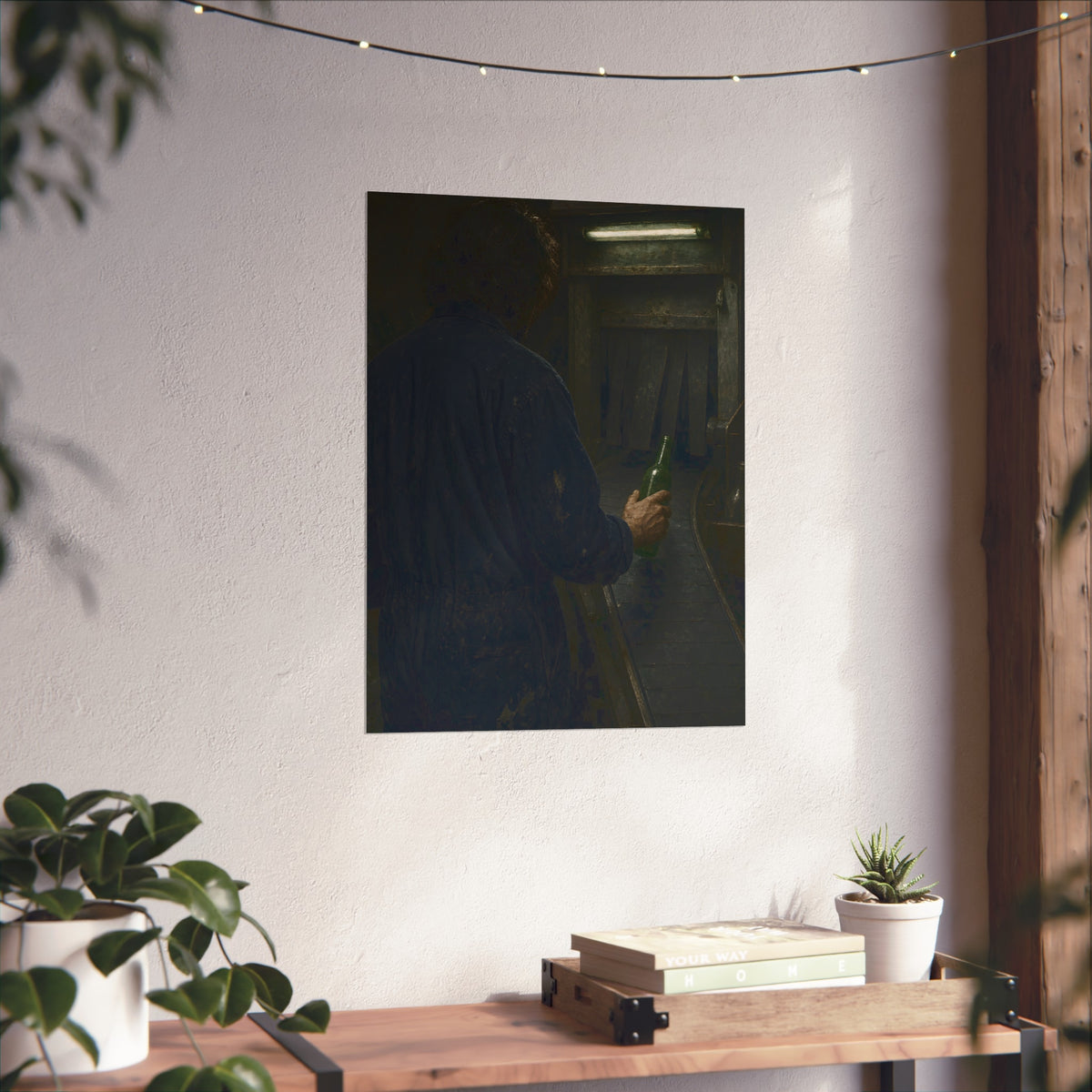 A man in coveralls sets a green bottle on a conveyor under a strip light. Garabaggio at the Conveyor by Garabaggio, fine art print hanging in a room.