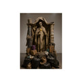 Draped standing figure under a canopy above a heap of black garbage bags. Saint Francis of the Black Bag by Garabaggio, fine art print, 12″ x 16″.