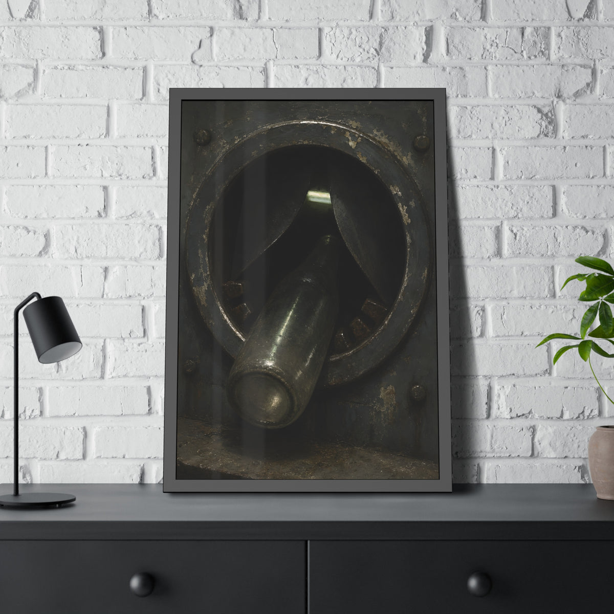 A glass bottle wedged in the round steel intake of a crushing machine. The Crusher's Mouth by Garabaggio, framed fine art print hanging in a room.