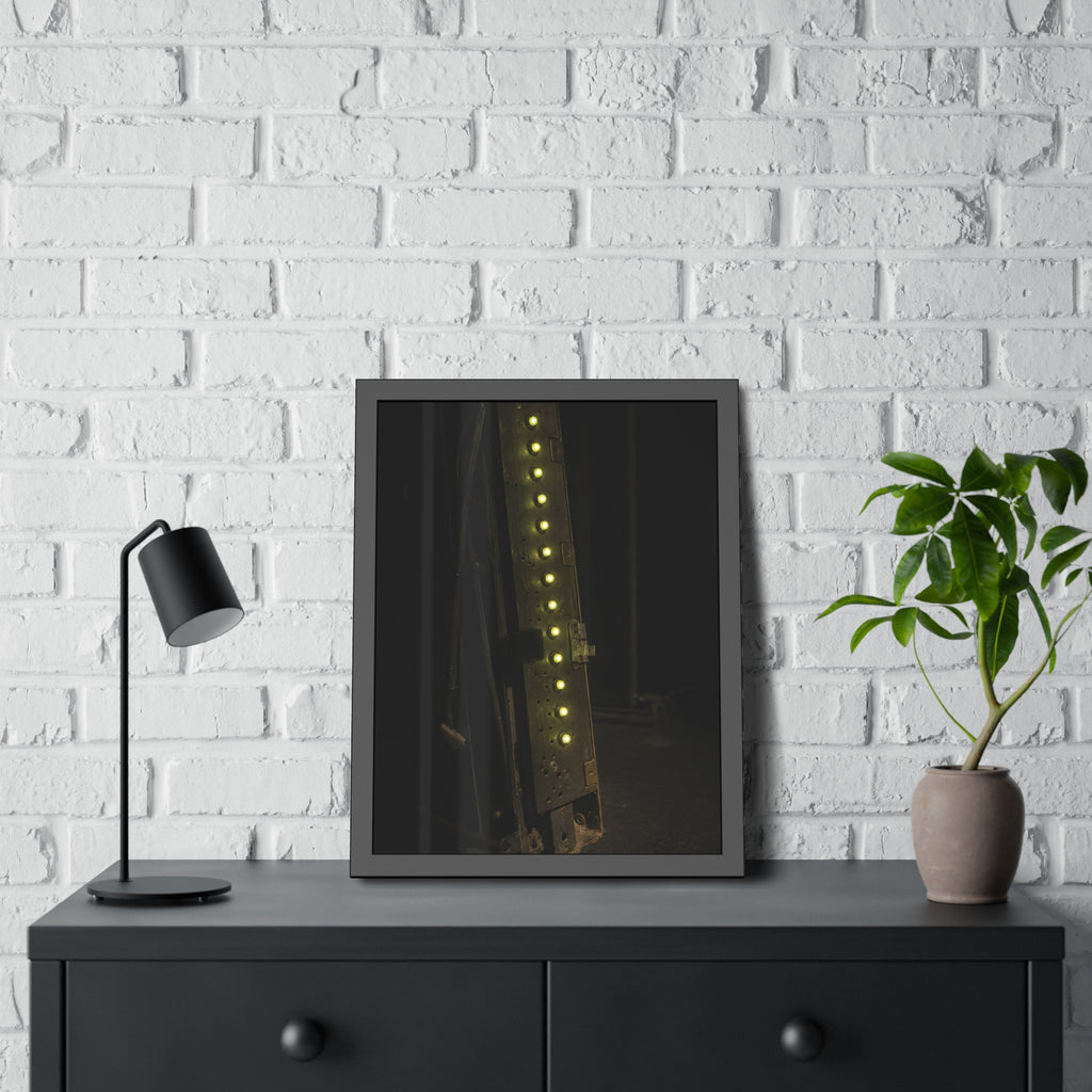 A dark rack panel with a vertical row of glowing green indicator lights. The First Green Choir by Garabaggio, framed fine art print hanging in a room.