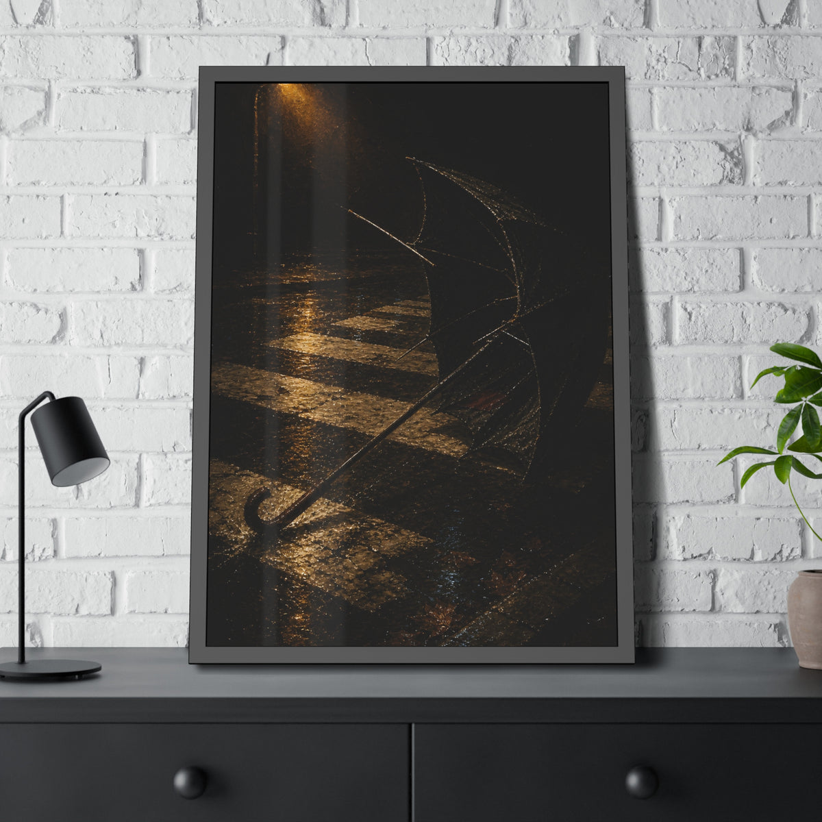 A blown out umbrella lying on wet checkered pavement under a street lamp. The Taking by the Wind by Garabaggio, framed fine art print hanging in a room.