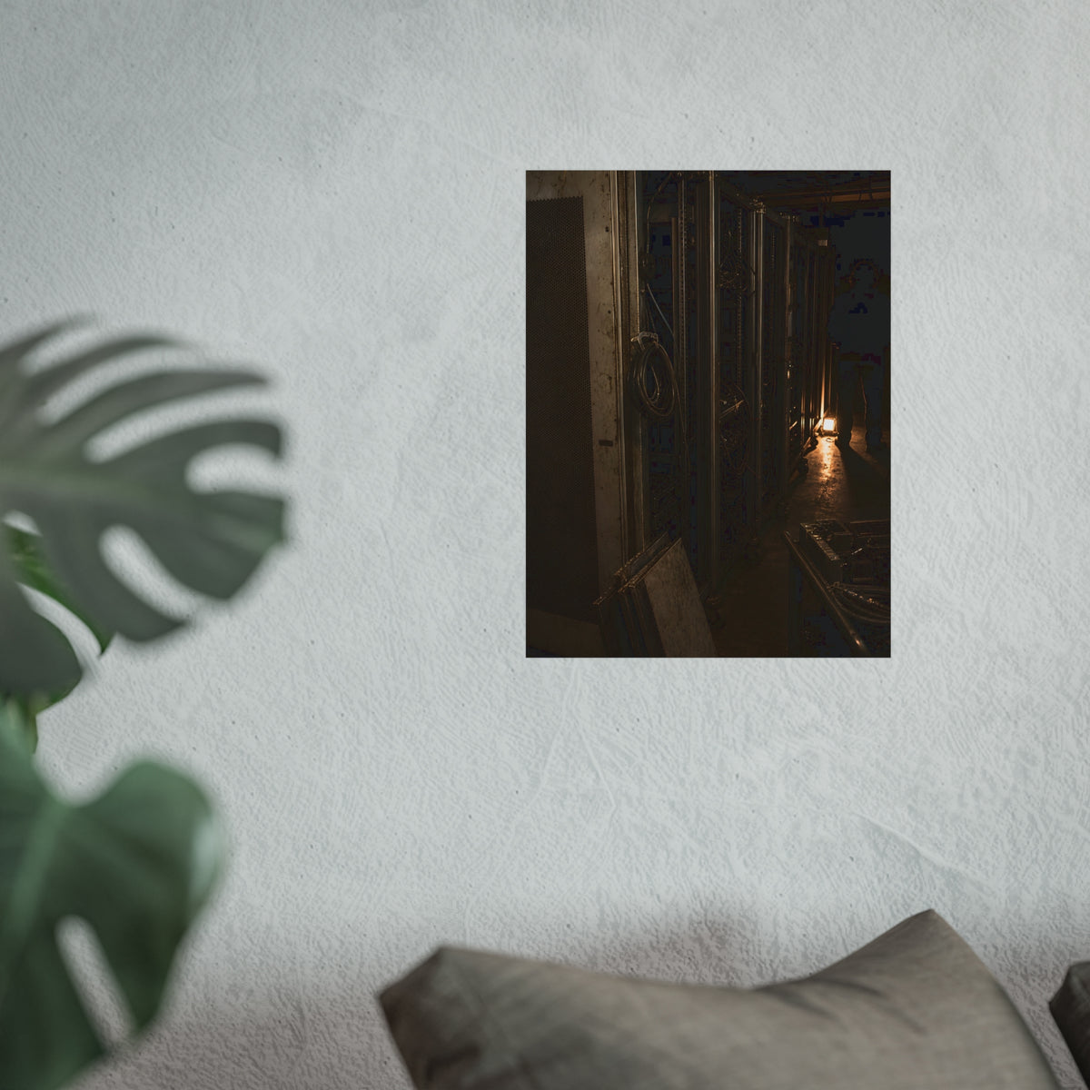 Open server racks in a dark room, a work lamp and a figure at the end. Garabaggio at the End of the Row by Garabaggio, fine art print hanging in a room.