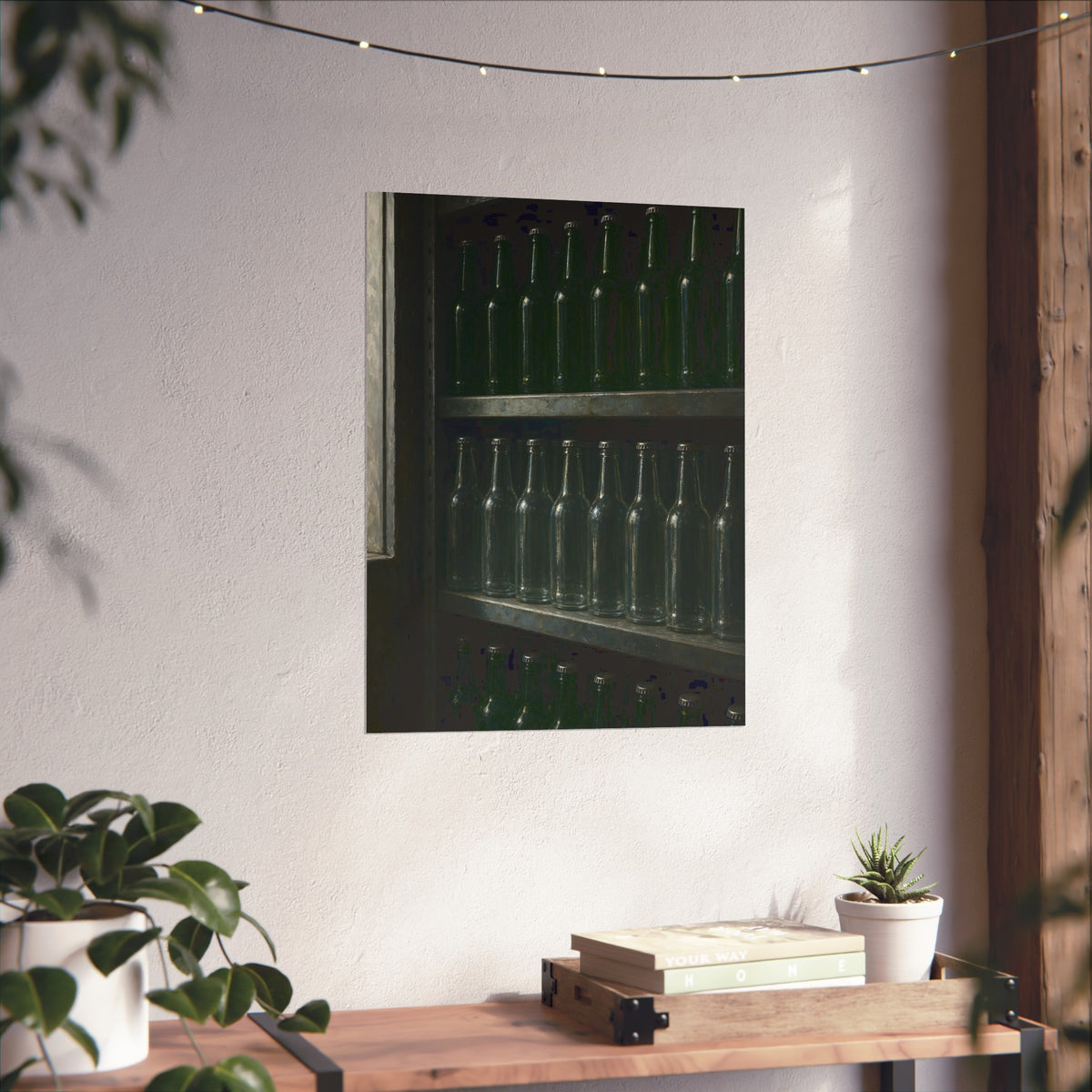 Rows of empty bottles on dim metal shelves, green above and clear below. The Shelf of New Bottles by Garabaggio, fine art print hanging in a room.