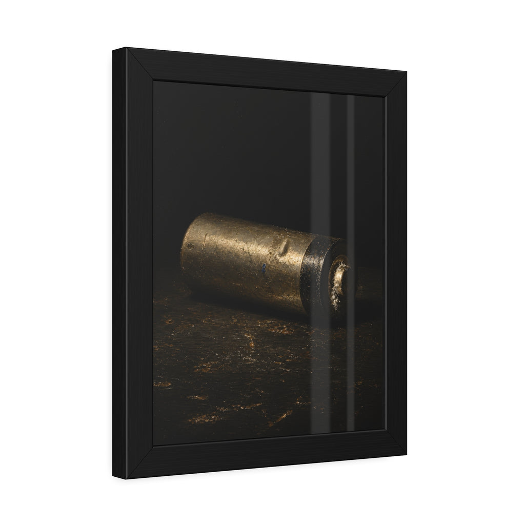 A corroded AA battery lying on a dark gritty surface in a single beam. The First Exhaustion by Garabaggio, framed fine art print hanging in a room.