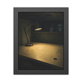 A lit desk lamp on an emptied office desk at night. The Desk Lamp Still Warm by Garabaggio, framed fine art print, 11″ x 14″.