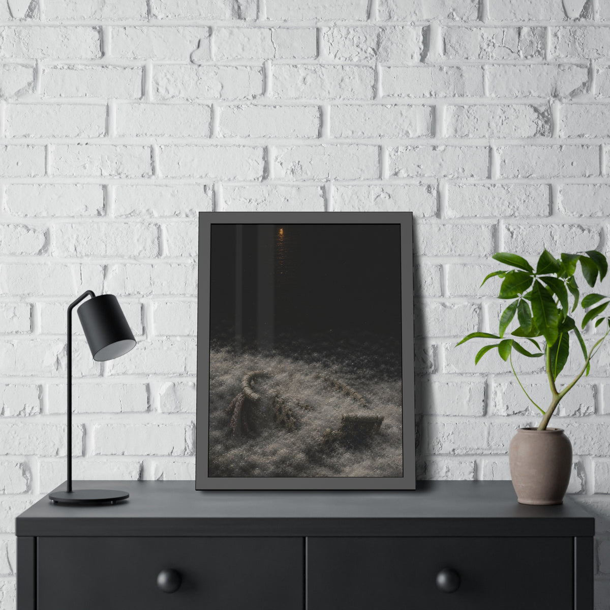 A broken laundry basket half buried in a snowbank under a distant light. Lattice in the Snowbank by Garabaggio, framed fine art print hanging in a room.