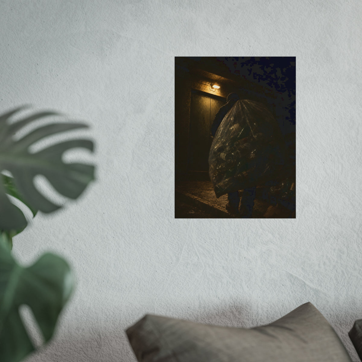 A man carrying a huge bag of bottles past a lit doorway at night. The Bag Carried Before Dawn by Garabaggio, fine art print hanging in a room.
