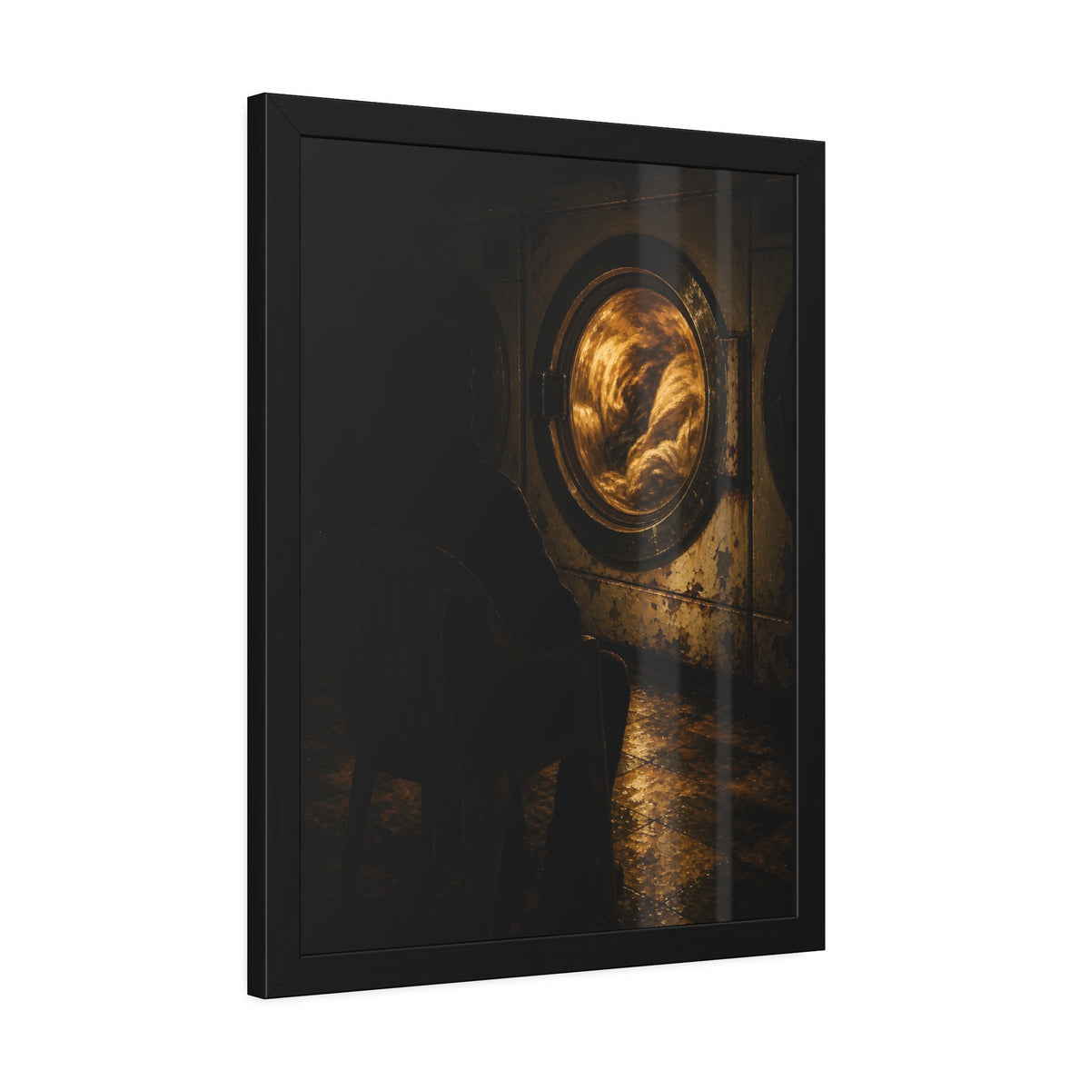 A person seated in a plastic chair facing a lit dryer drum. The Watcher in the Plastic Chair by Garabaggio, framed fine art print hanging in a room.