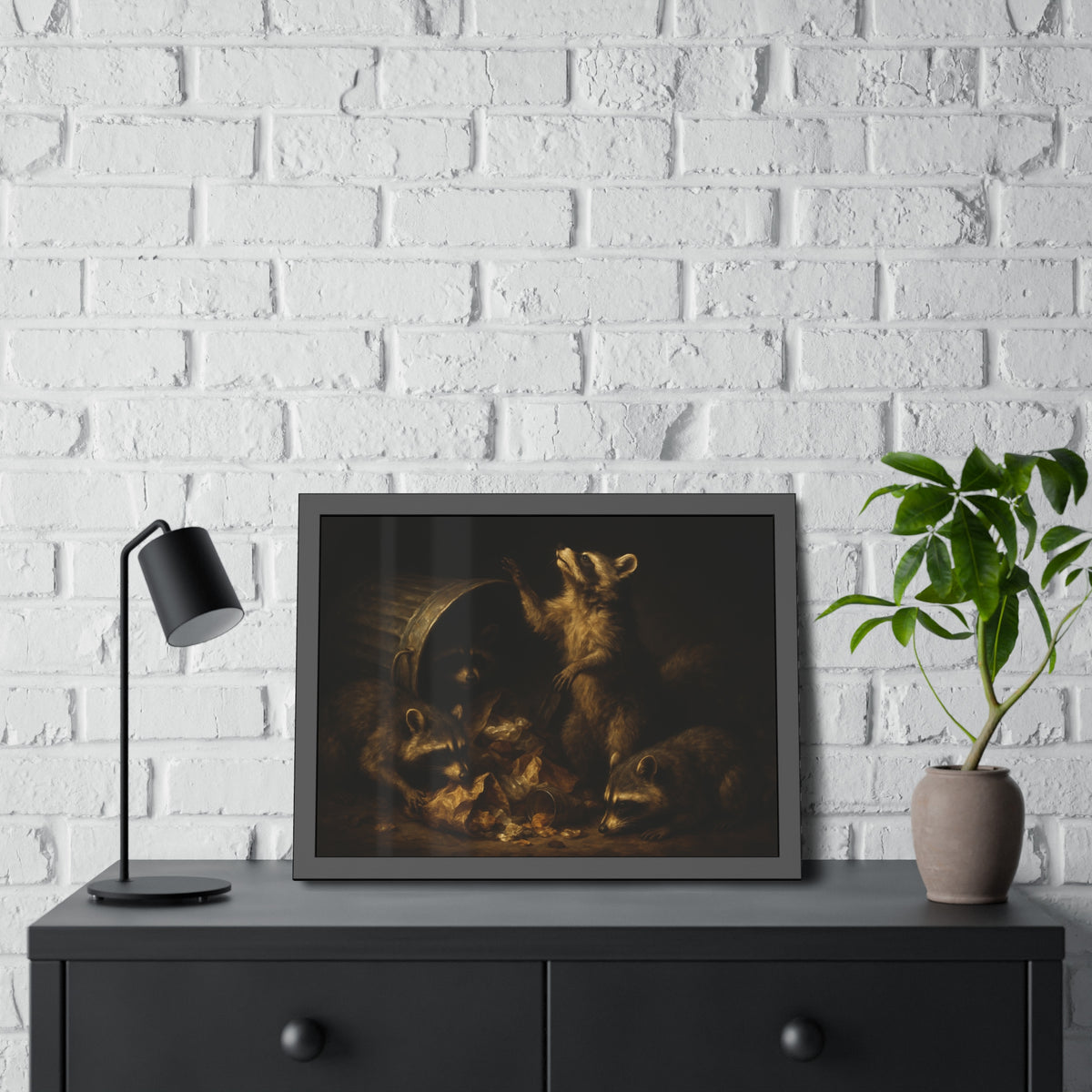 Raccoons around a fallen trash can, one rearing up with a raised paw. The Supper of Shadows by Garabaggio, framed fine art print hanging in a room.