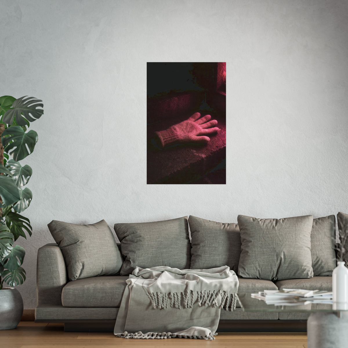 A knitted glove lying flat on a concrete step under pink light. The Vigil in Pink Light by Garabaggio, fine art print hanging in a room.
