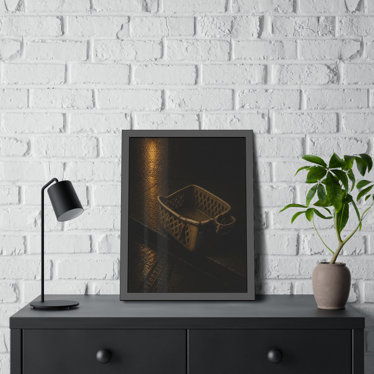 A cracked plastic laundry basket with a warped rim on wet asphalt. The Crushing of the Rim by Garabaggio, framed fine art print hanging in a room.