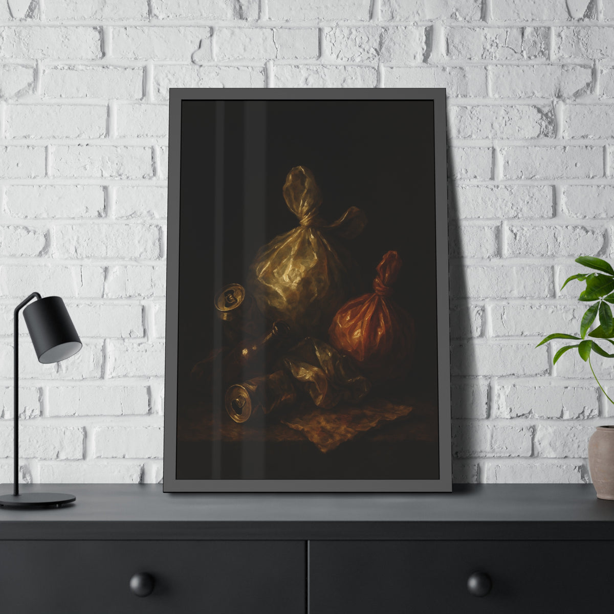 Two knotted plastic bags and crushed cans on a dark table. The Knotted Offering by Garabaggio, framed fine art print hanging in a room.