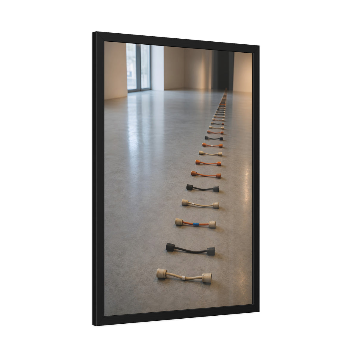 A long line of cut extension cord ends laid across a pale gallery floor. The Severed Procession by Garabaggio, framed fine art print hanging in a room.