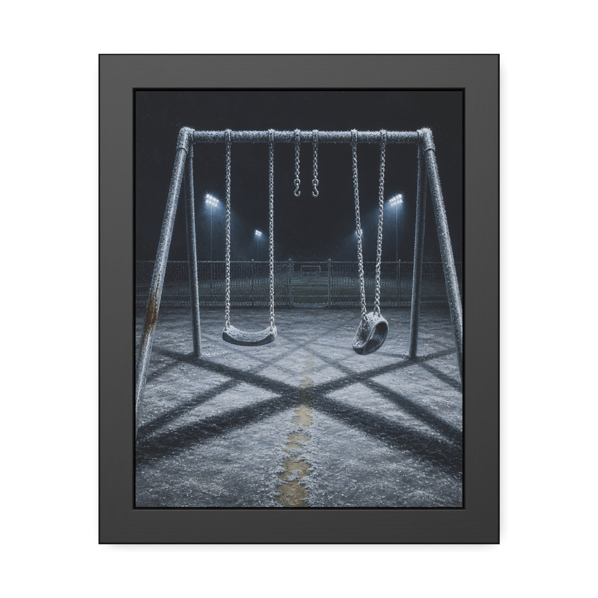 A frost covered swing set on empty asphalt under distant floodlights. The Third Hour: The Coldest Part by Garabaggio, framed fine art print, 11″ x 14″.