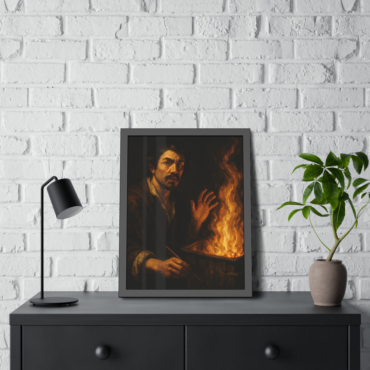 Man holding a paintbrush, his other hand raised beside tall flames. Self-Portrait with Brush and Flame by Garabaggio, framed fine art print hanging in a room.
