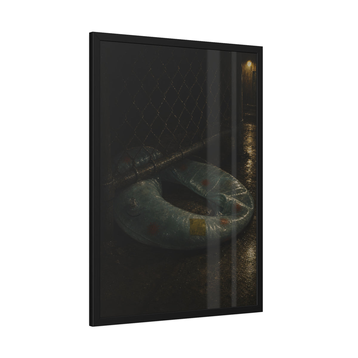 A deflated ring float pushed under a chain link fence in a wet alley. The Escape Beneath the Fence by Garabaggio, framed fine art print hanging in a room.