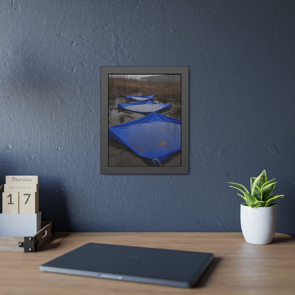Three blue tarps holding pooled rainwater in a weedy vacant lot. Flooded in the Vacant Lot by Garabaggio, framed fine art print hanging in a room.
