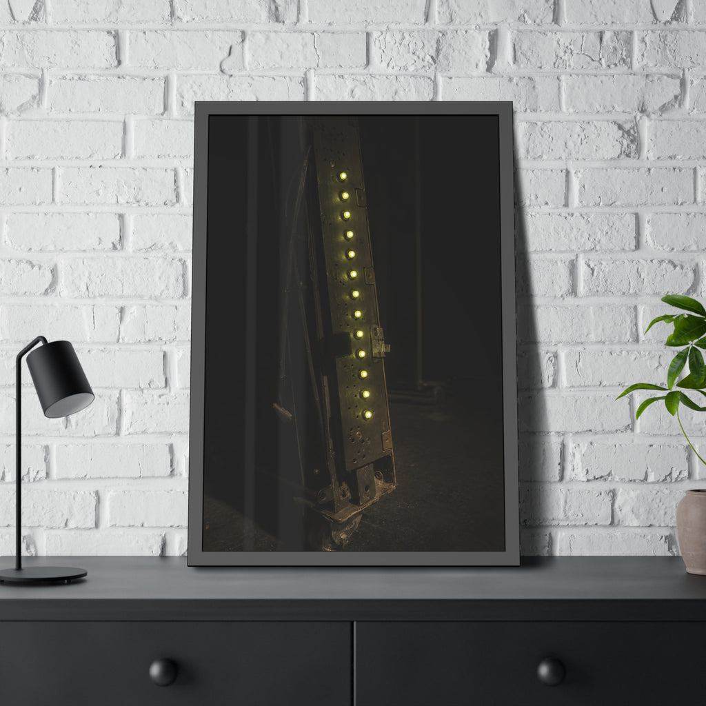 A dark rack panel with a vertical row of glowing green indicator lights. The First Green Choir by Garabaggio, framed fine art print hanging in a room.