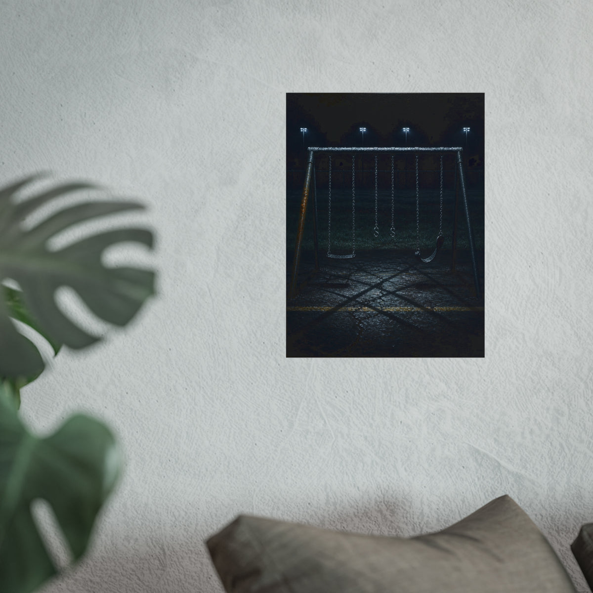 An empty swing set with a rusted leg on cracked asphalt. The Second Hour: The Rust Shaped Like a Hand by Garabaggio, fine art print hanging in a room.