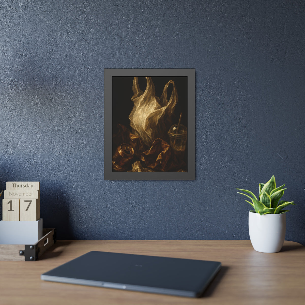 A plastic bag held open above a crushed can and a plastic cup with straw. The Apparition of the Bag by Garabaggio, framed fine art print hanging in a room.