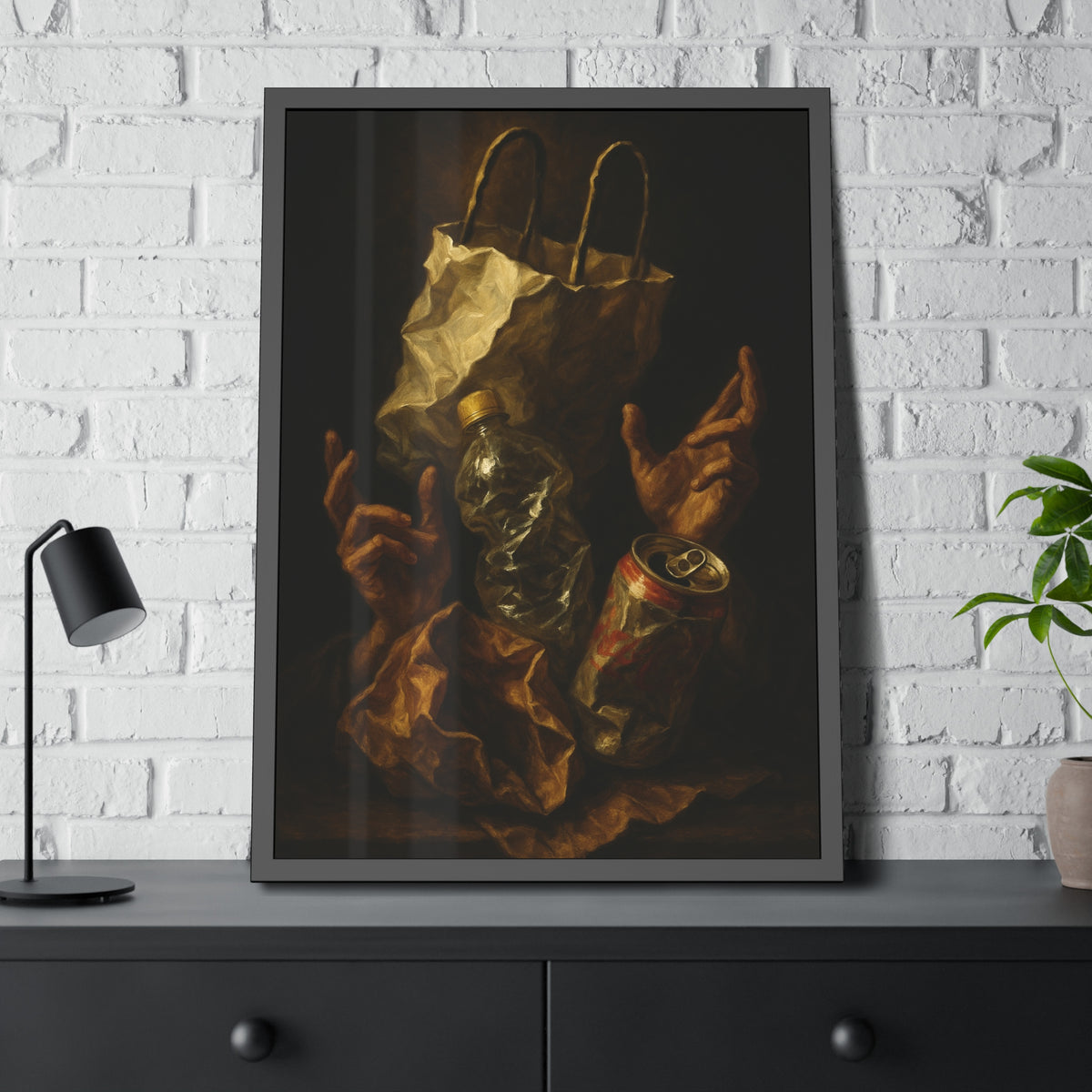 Two hands raised beside a paper bag, crushed bottle and dented can. The Assumption of the Discarded by Garabaggio, framed fine art print hanging in a room.