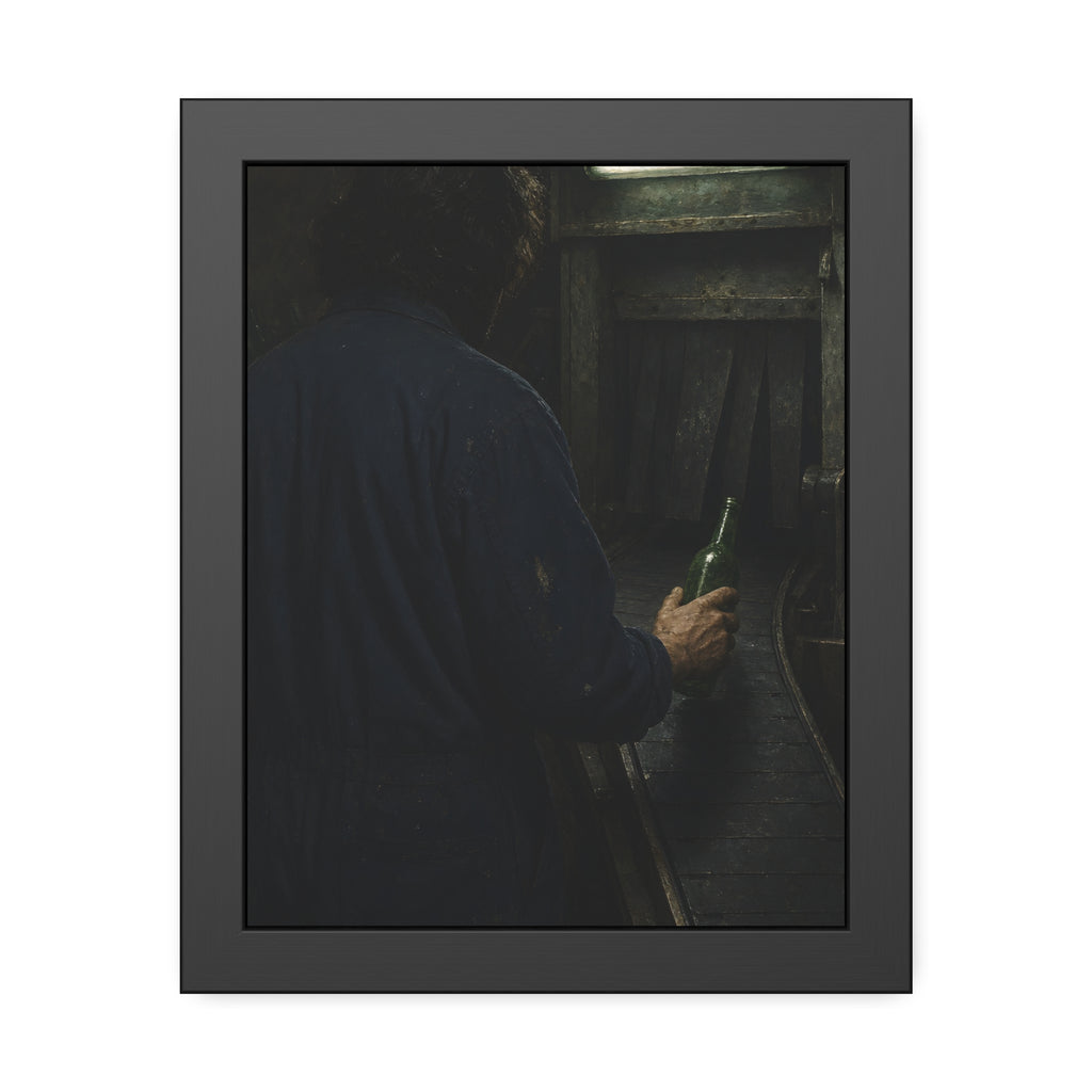 A man in coveralls sets a green bottle on a conveyor under a strip light. Garabaggio at the Conveyor by Garabaggio, framed fine art print, 11″ x 14″.