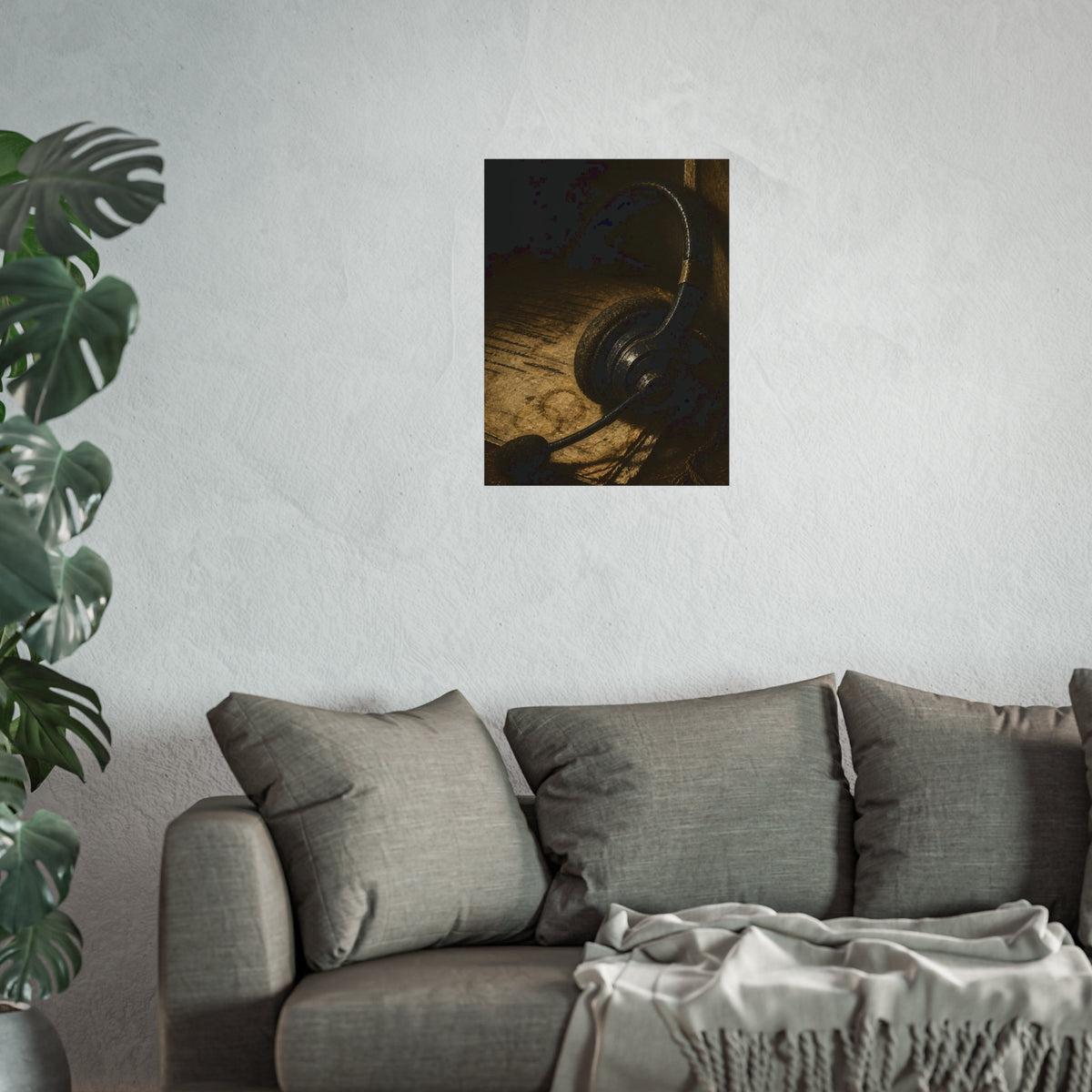 A worn headset resting on a printed script page with coffee rings. The Script Beside the Mouthpiece by Garabaggio, fine art print hanging in a room.