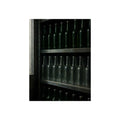 Rows of empty bottles on dim metal shelves, green above and clear below. The Shelf of New Bottles by Garabaggio, fine art print, 12″ x 16″.