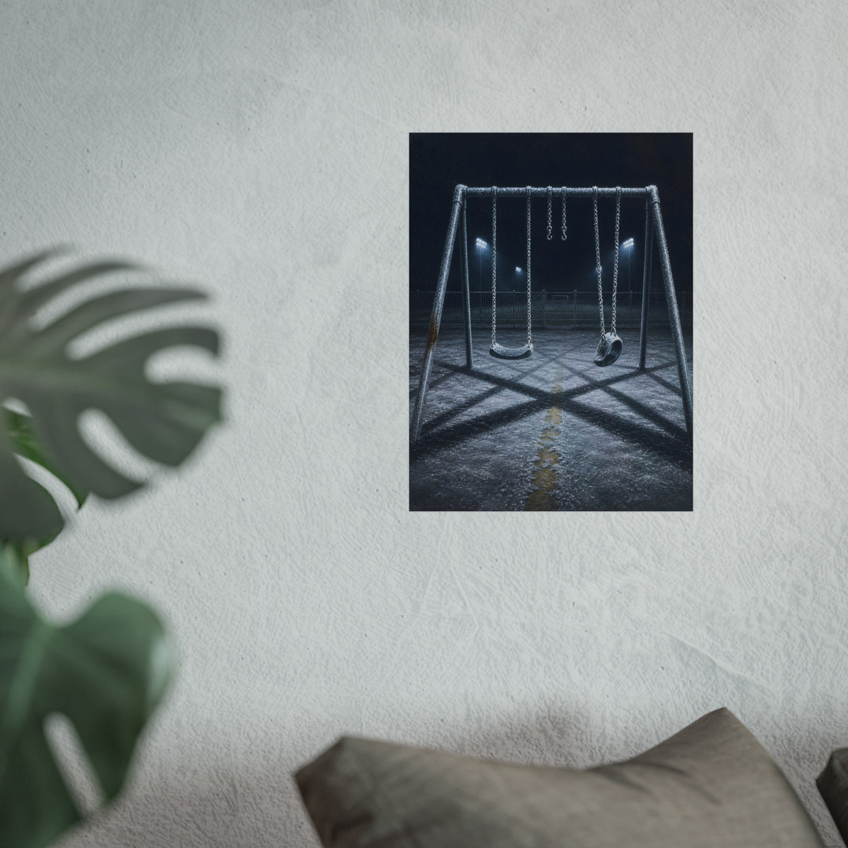 A frost covered swing set on empty asphalt under distant floodlights. The Third Hour: The Coldest Part by Garabaggio, fine art print hanging in a room.