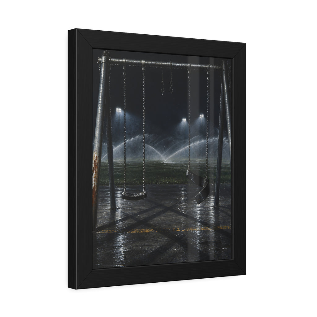 An empty swing set on wet asphalt, sprinklers arcing over the field. The Eleventh Hour: The Sprinklers by Garabaggio, framed fine art print hanging in a room.
