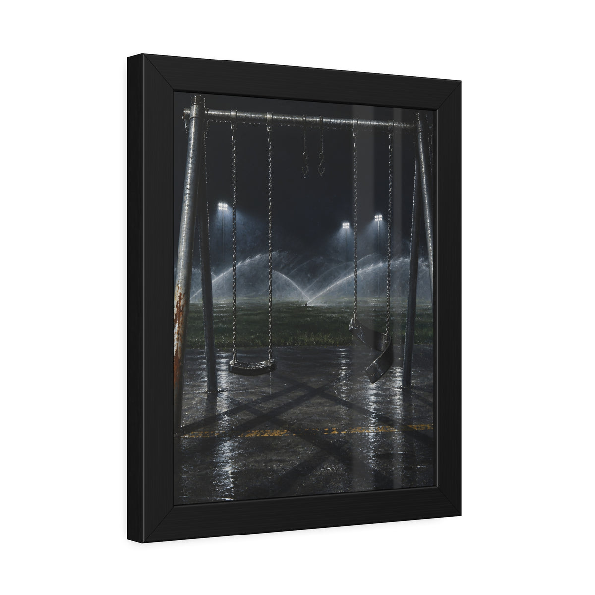An empty swing set on wet asphalt, sprinklers arcing over the field. The Eleventh Hour: The Sprinklers by Garabaggio, framed fine art print hanging in a room.