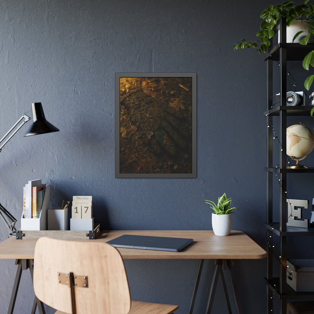 Wet mud and pressed oak leaves with a green scrap barely showing. The Reliquary of Mud and Leaf by Garabaggio, framed fine art print hanging in a room.