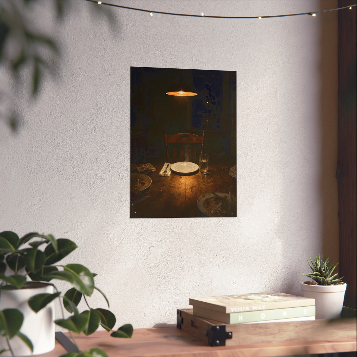 A clean plate and empty chair under a hanging lamp at a used dinner table. The Empty Seat at Dinner by Garabaggio, fine art print hanging in a room.