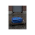 A folded blue tarp stacked on a low wooden platform by a loading dock. The Repaired Fold by Garabaggio, fine art print, 12″ x 16″.
