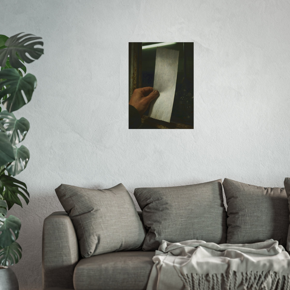 A hand holding a blank slip at a rusted counter window, bottles behind. The Receipt of Absolution by Garabaggio, fine art print hanging in a room.