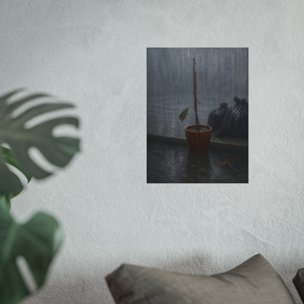A bare stick in a clay pot on a curb in heavy rain beside trash bags. The Second Rain by Garabaggio, fine art print hanging in a room.