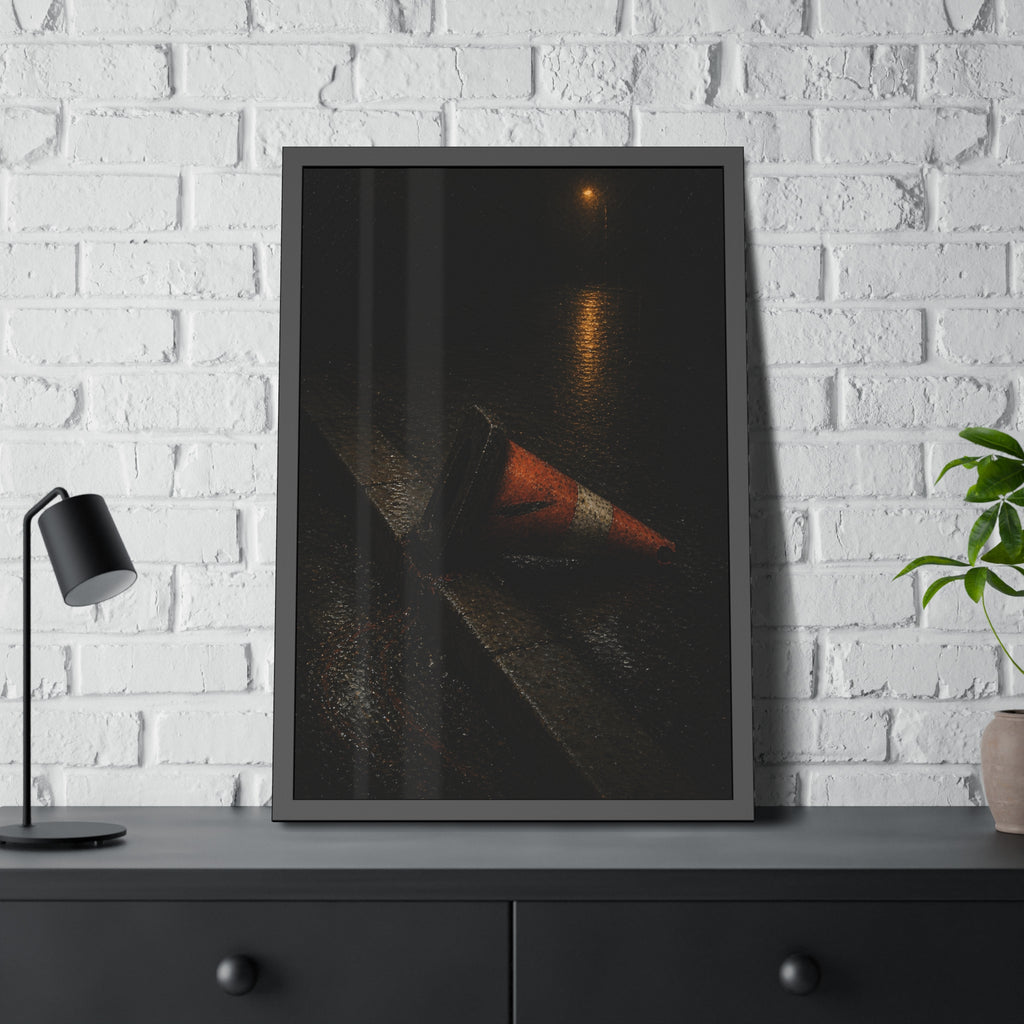 An orange traffic cone toppled on a wet curb under a distant streetlamp. The Dragging Through Rain by Garabaggio, framed fine art print hanging in a room.