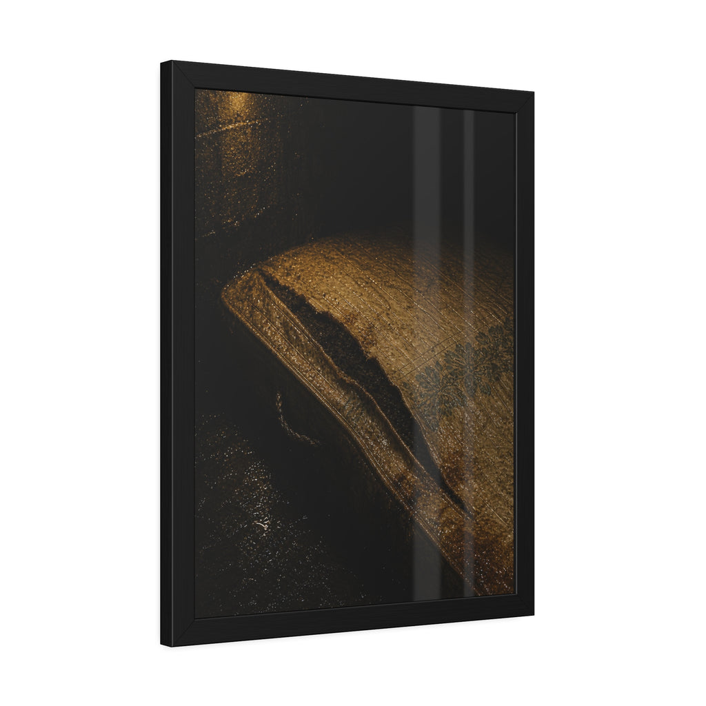A mattress with its seam split open, lit warm against a dark wall. The Opening of the Ticking by Garabaggio, framed fine art print hanging in a room.