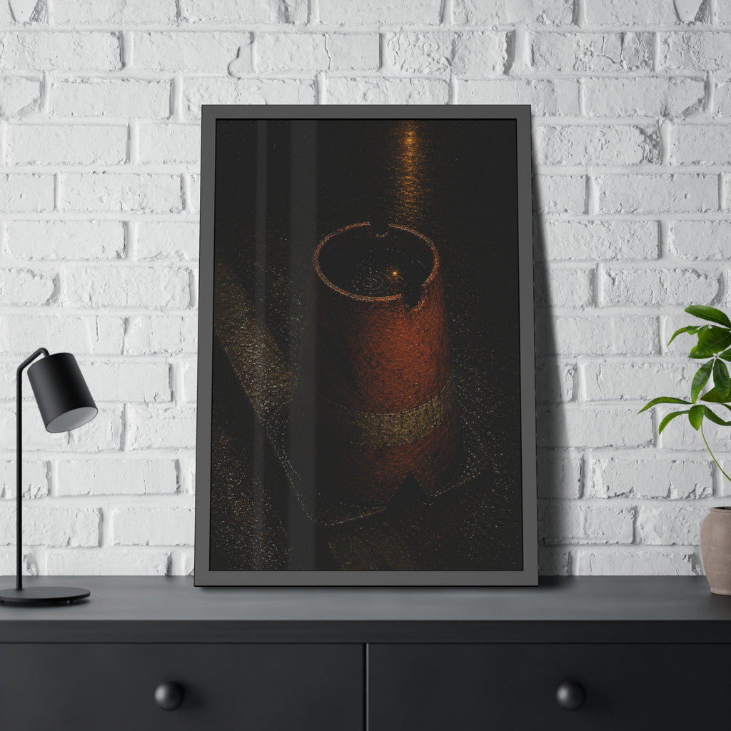 An upturned traffic cone holding rainwater at a wet curb under a lamp. The Cup of Rain by Garabaggio, framed fine art print hanging in a room.